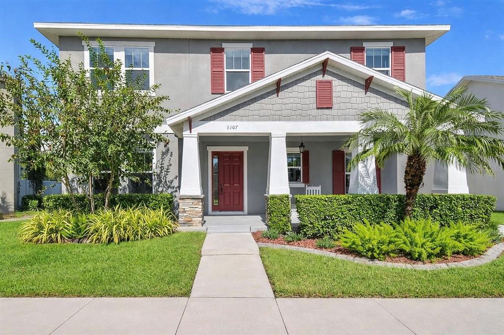 5107 Autumn Ridge Drive Wesley Chapel, FL 33545 - Photo 1 of 1 a front view of a house with a garden