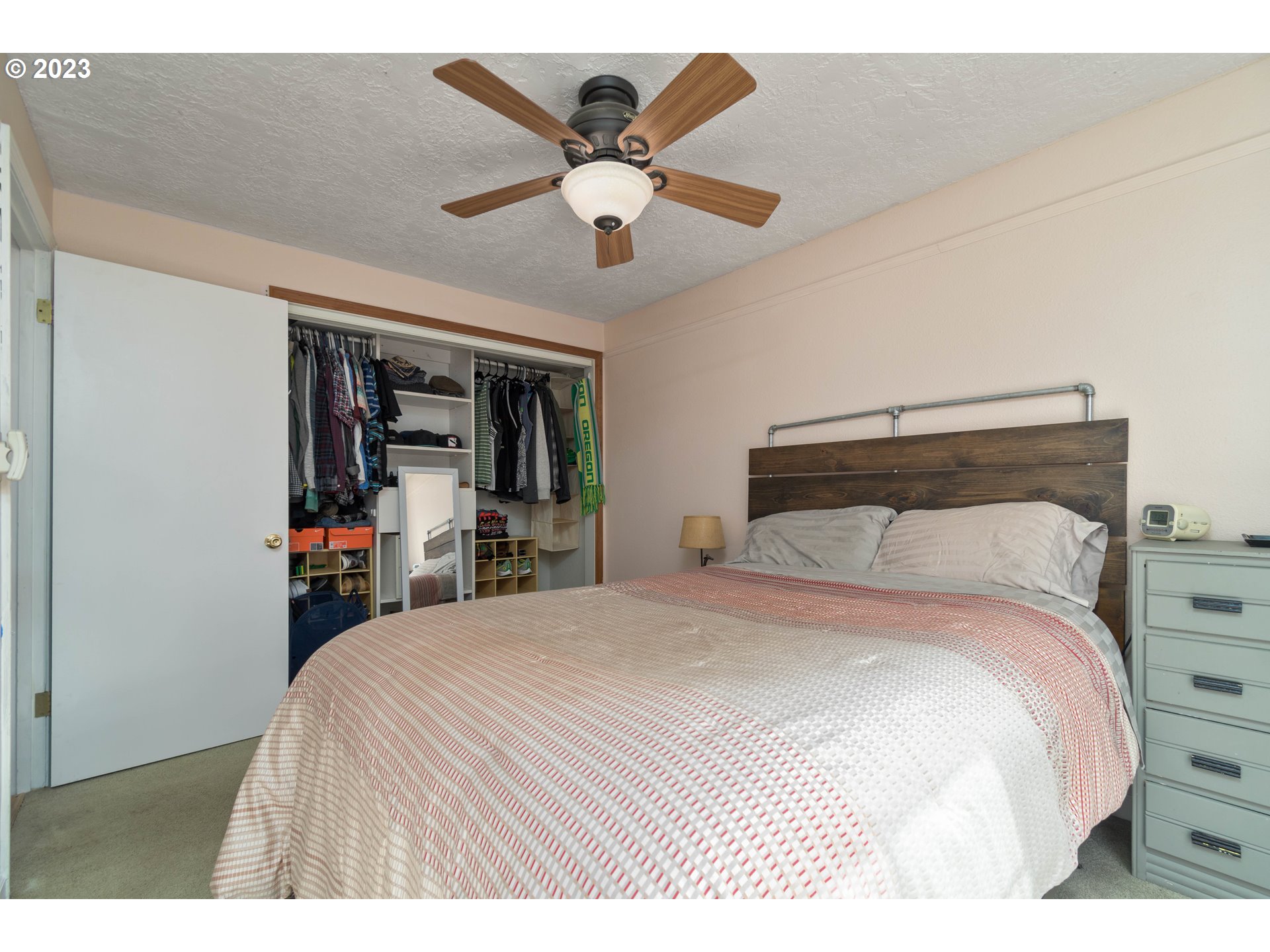 535 West M Street Springfield, OR 97477 - Photo 12 of 48 a bedroom with a large bed and a ceiling fan