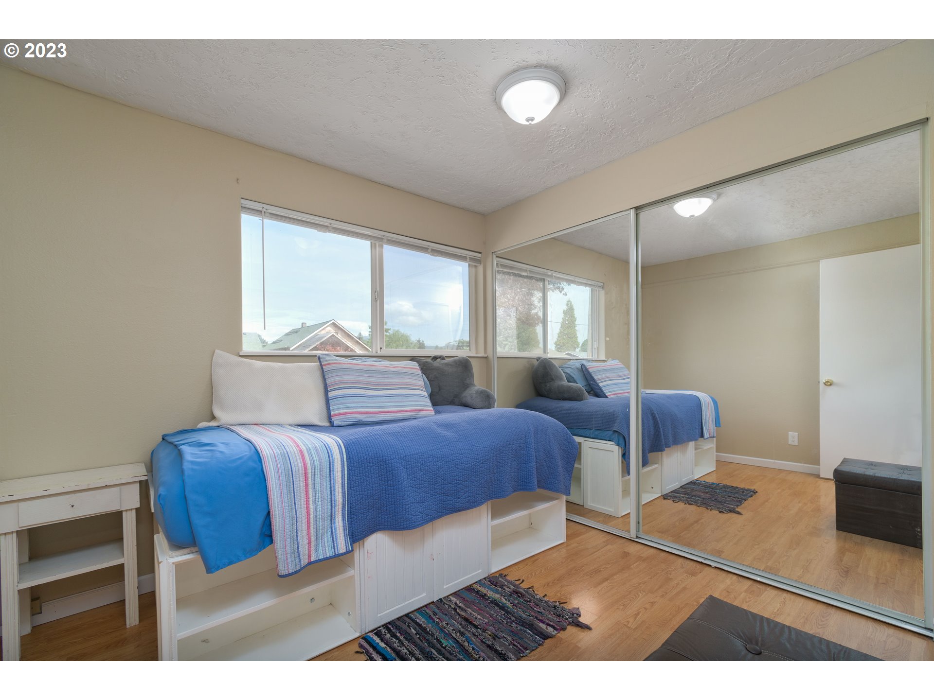 535 West M Street Springfield, OR 97477 - Photo 13 of 48 a bedroom with furniture and a window