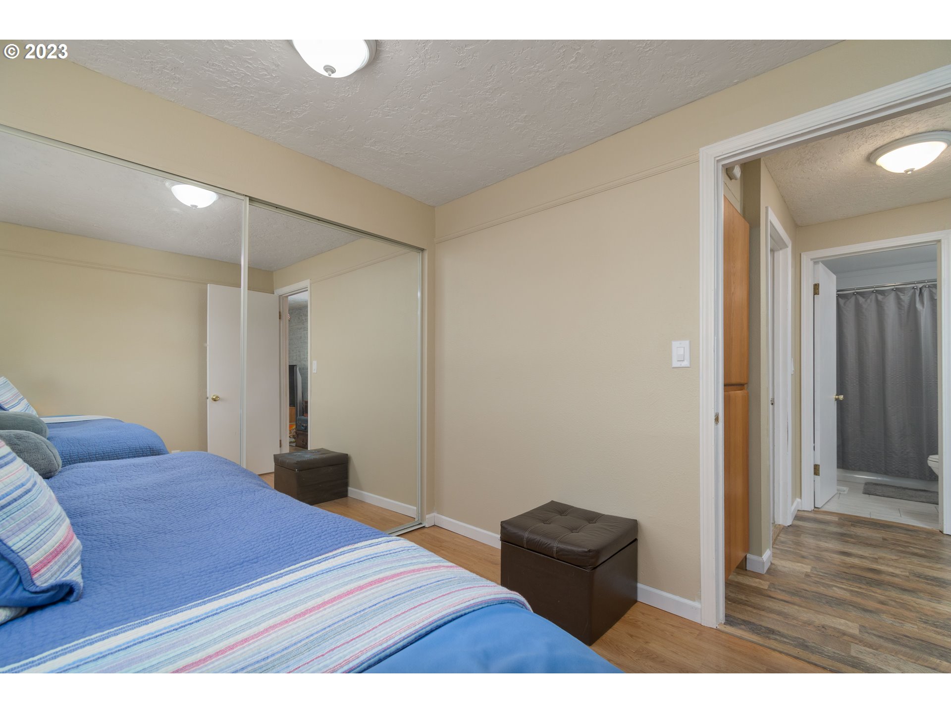 535 West M Street Springfield, OR 97477 - Photo 14 of 48 a bedroom with a bed and a chair