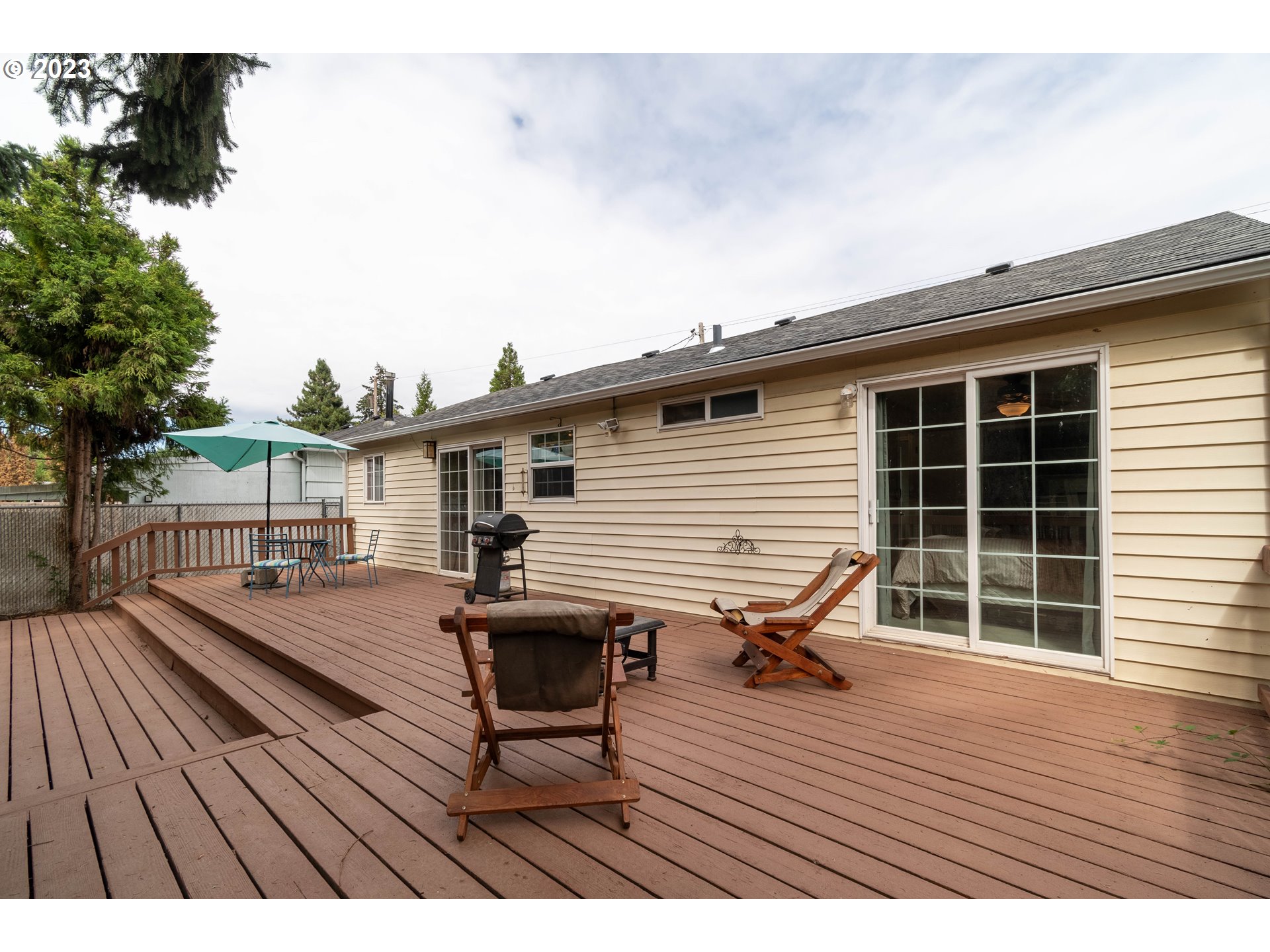 535 West M Street Springfield, OR 97477 - Photo 28 of 48 a view of a deck with wooden floor and seating space