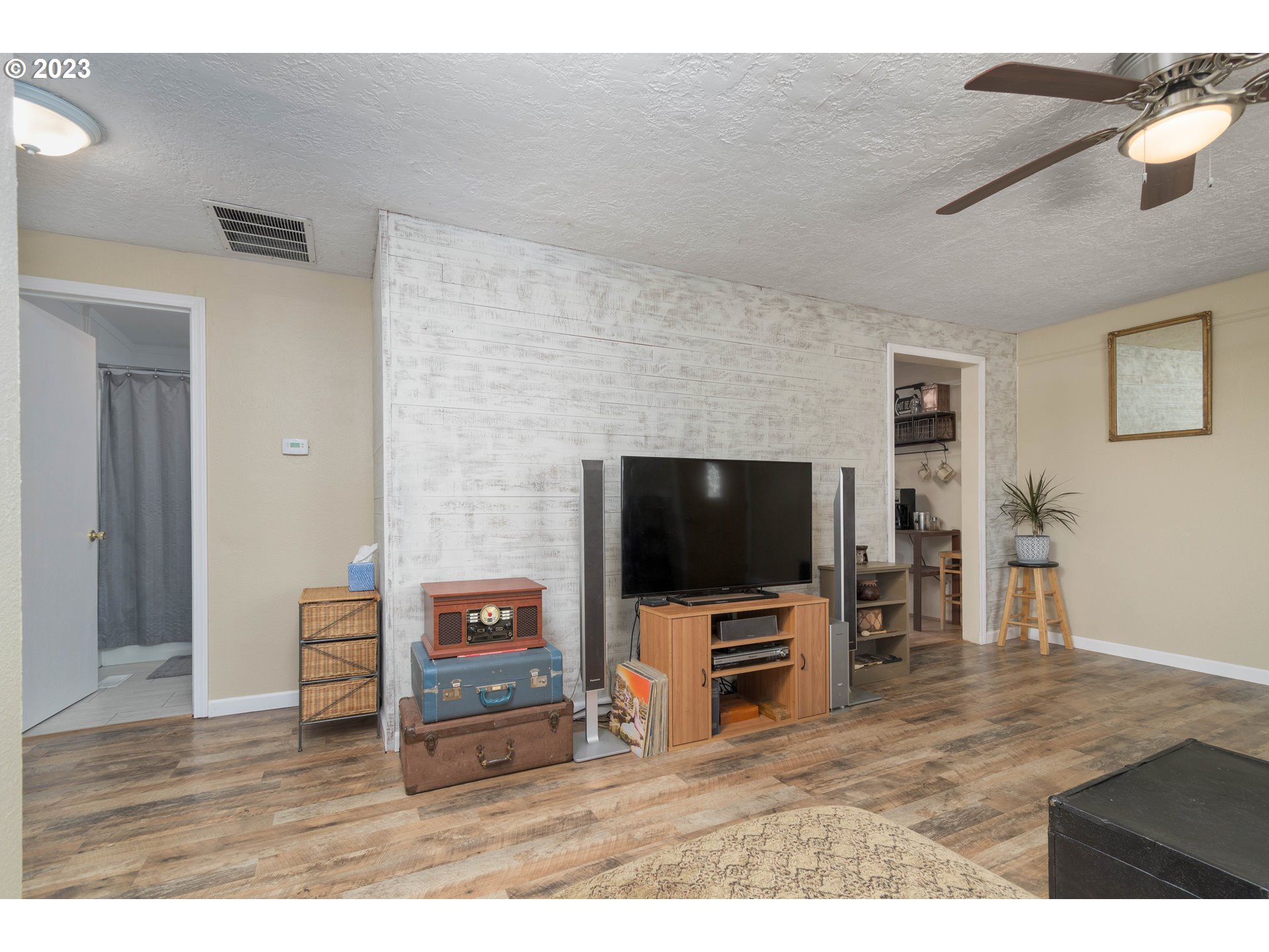 535 West M Street Springfield, OR 97477 - Photo 9 of 48 a living room with furniture and a flat screen tv