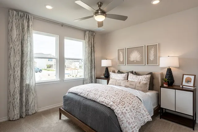 a bed room with a bed and a chandelier