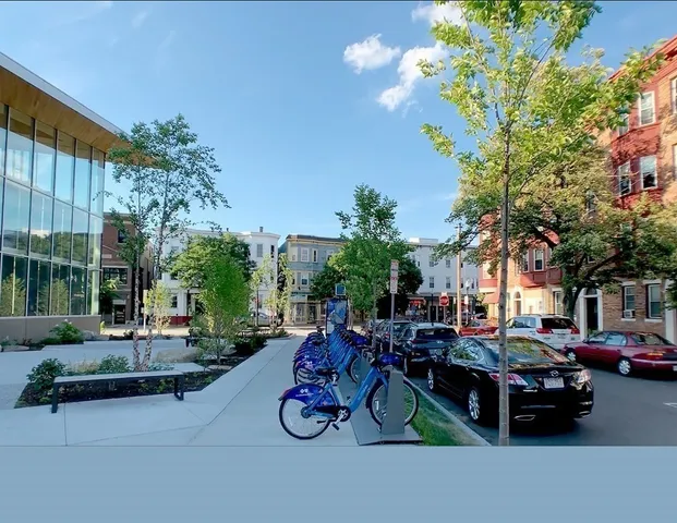 a view of street with sitting area