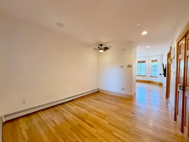 a view of a livingroom with wooden floor