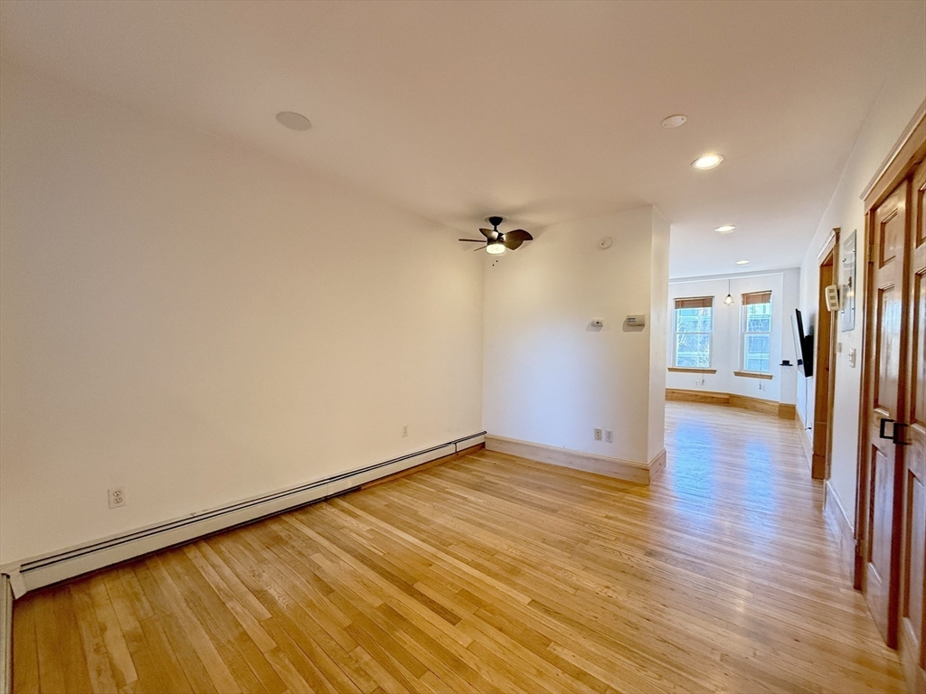 148 Berkshire Street, Unit 4 Cambridge, MA 02141 - Photo 6 of 17 a view of a livingroom with wooden floor