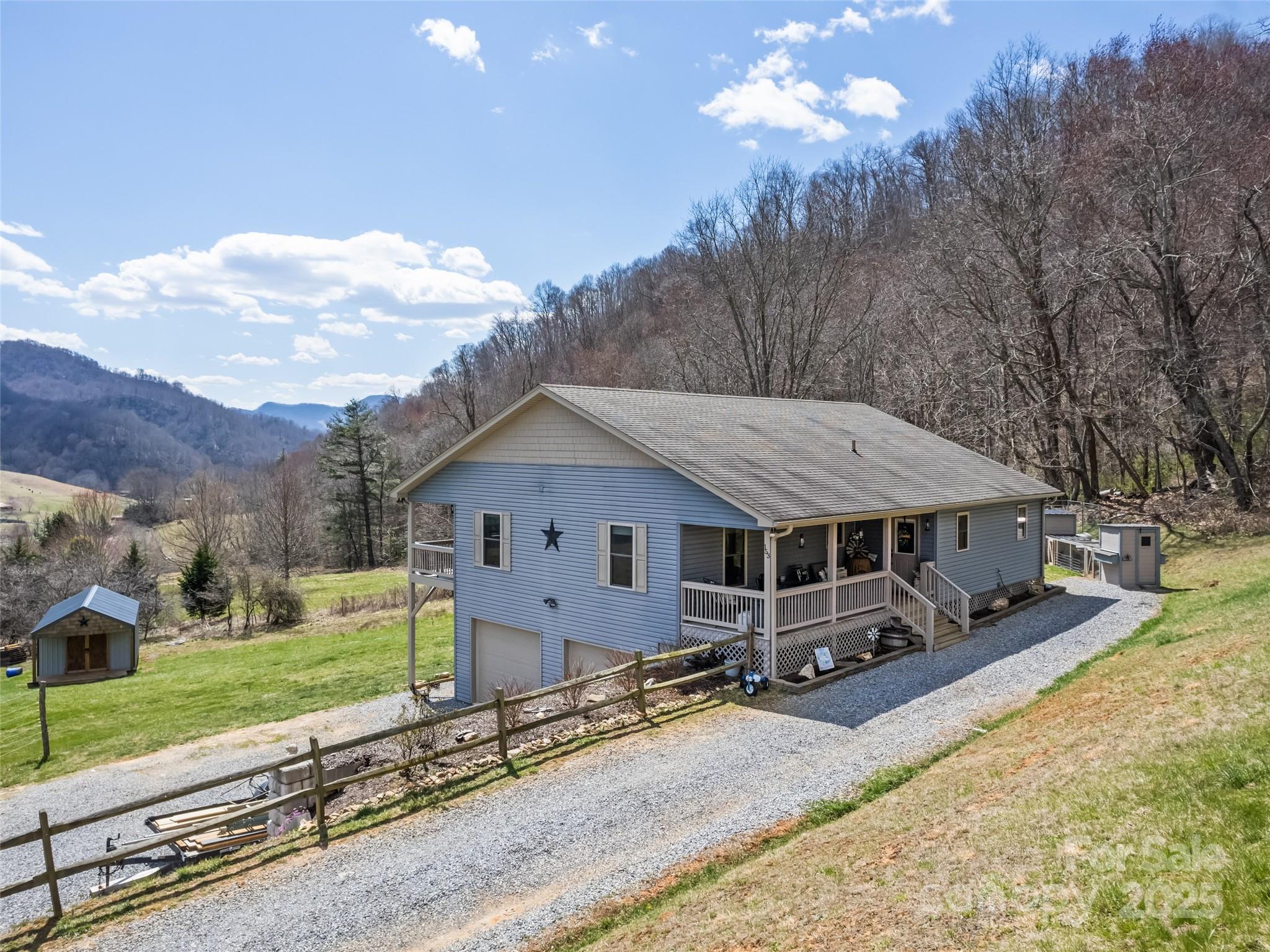 153 Trinity Drive Clyde, NC 28721 - Photo 1 of 38 a view of a house with a yard