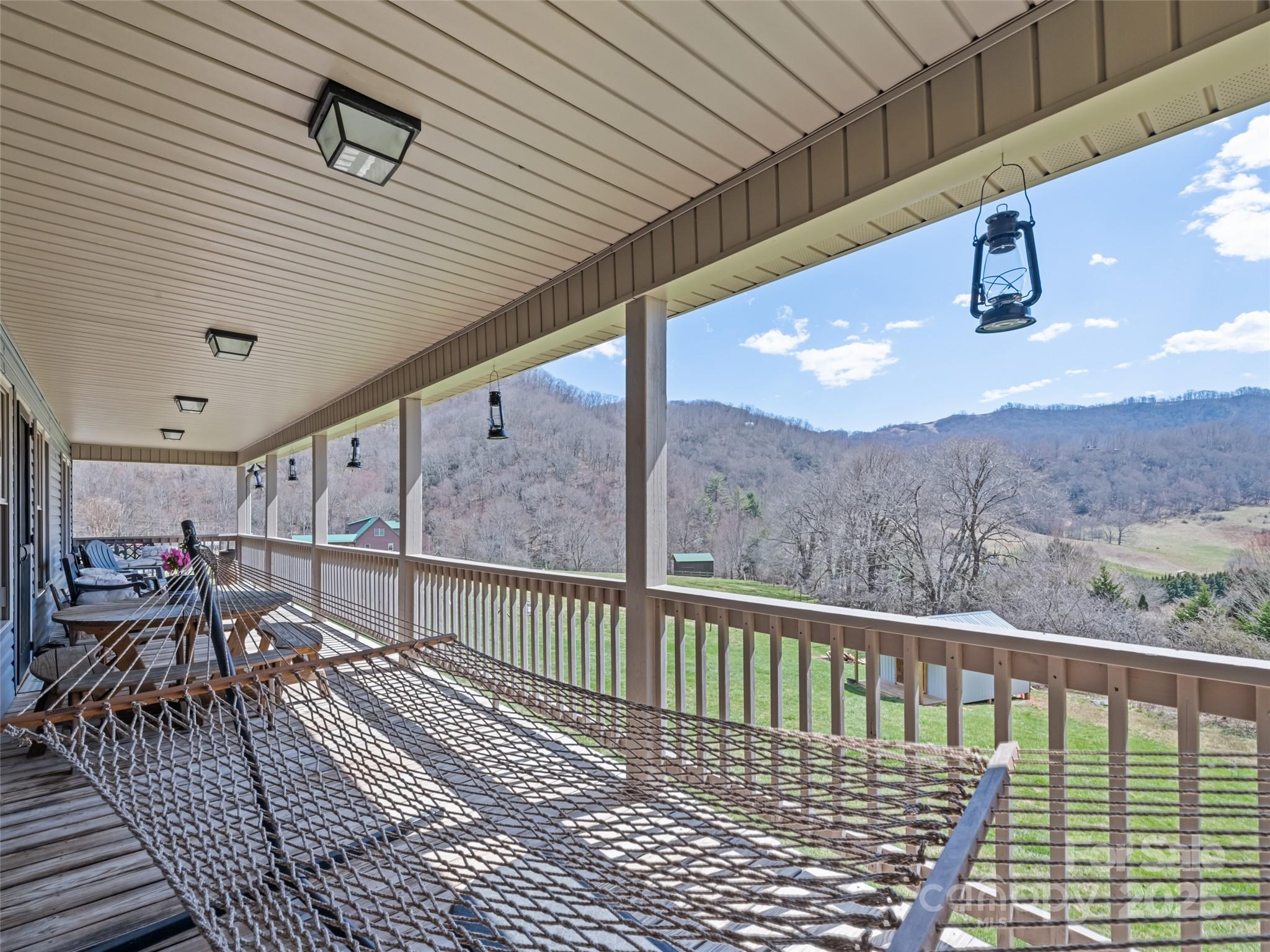 153 Trinity Drive Clyde, NC 28721 - Photo 13 of 38 a view of a balcony with chairs