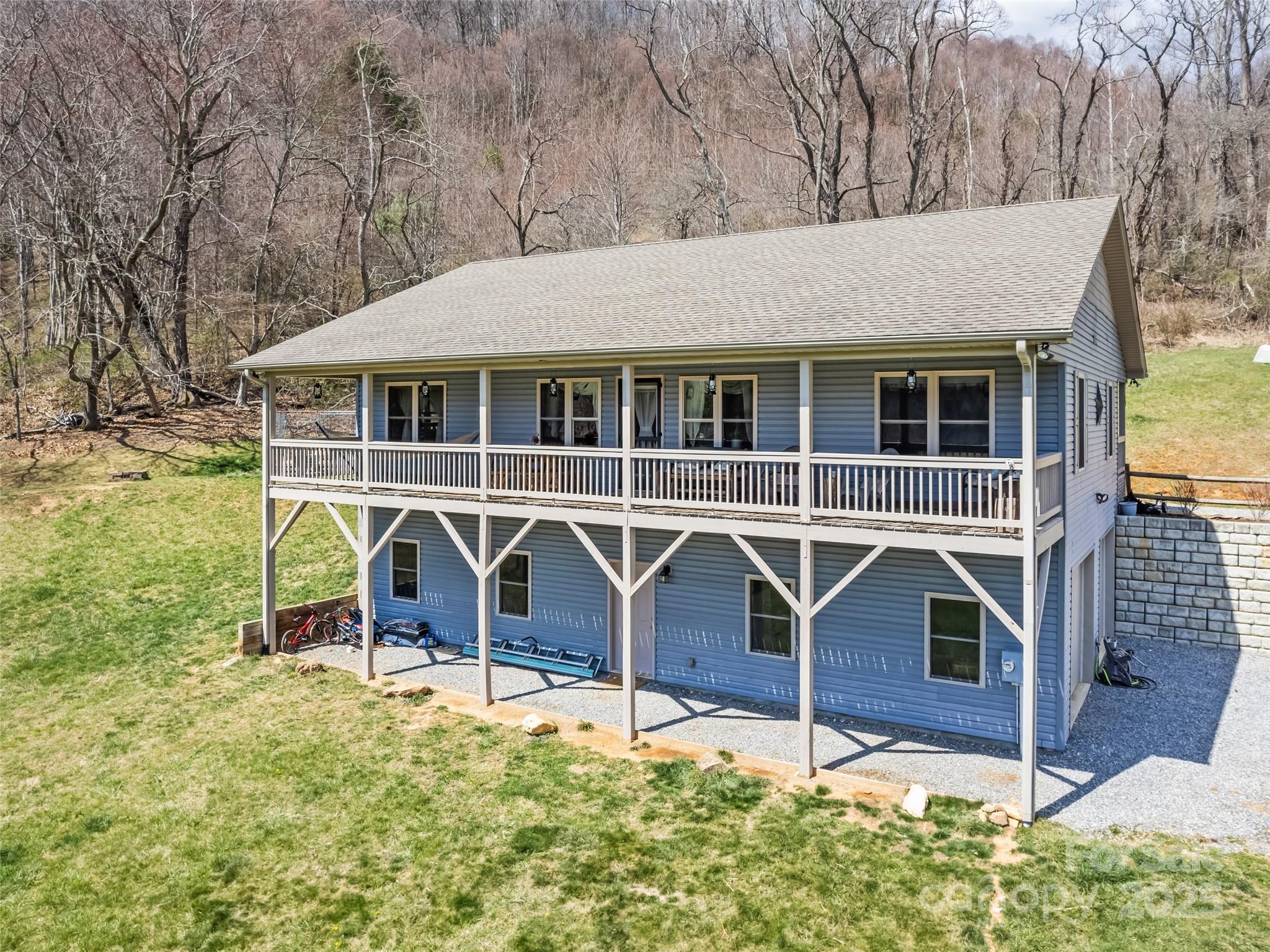 153 Trinity Drive Clyde, NC 28721 - Photo 2 of 38 front view of a house with a yard