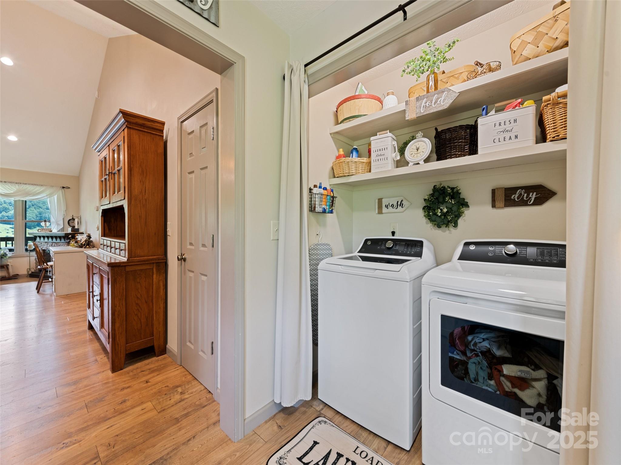 153 Trinity Drive Clyde, NC 28721 - Photo 24 of 38 a kitchen with stainless steel appliances granite countertop a stove and a refrigerator