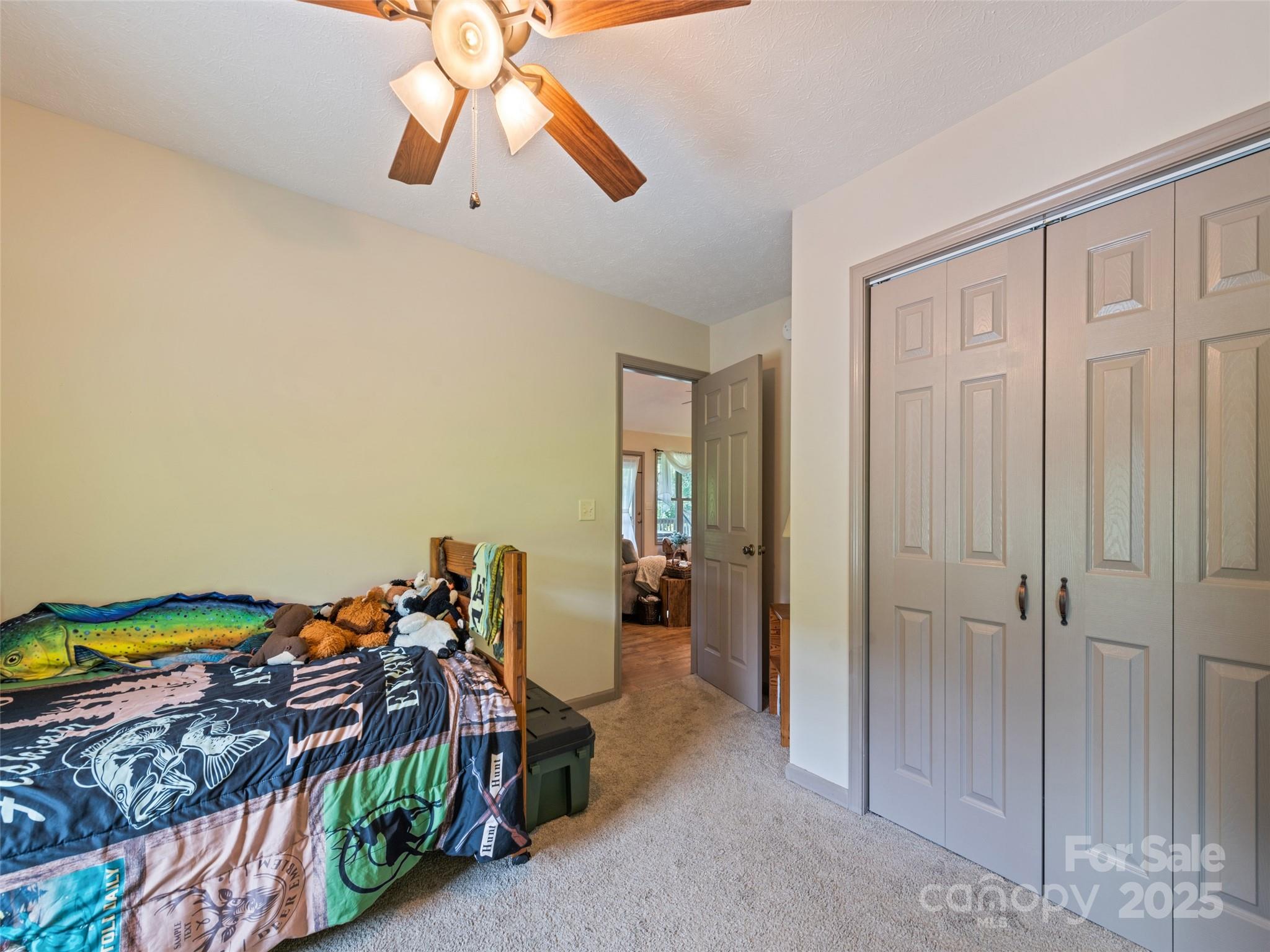 153 Trinity Drive Clyde, NC 28721 - Photo 35 of 38 a view of a hallway to a livingroom with furniture
