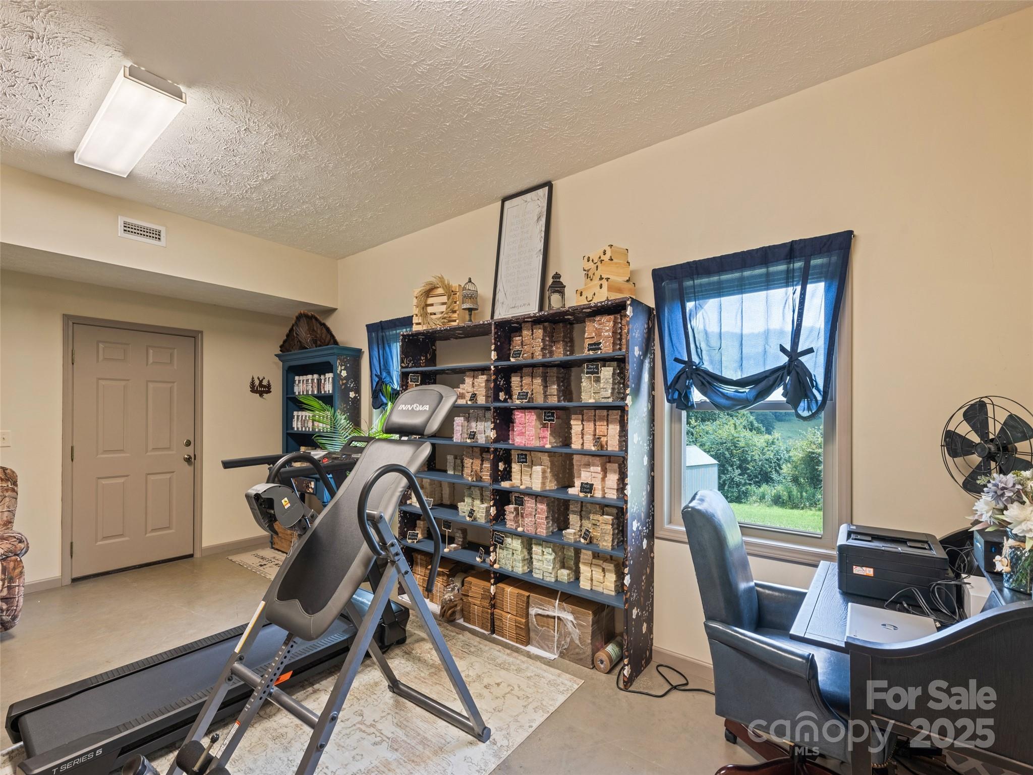 153 Trinity Drive Clyde, NC 28721 - Photo 38 of 38 a view of a workspace with furniture and a window