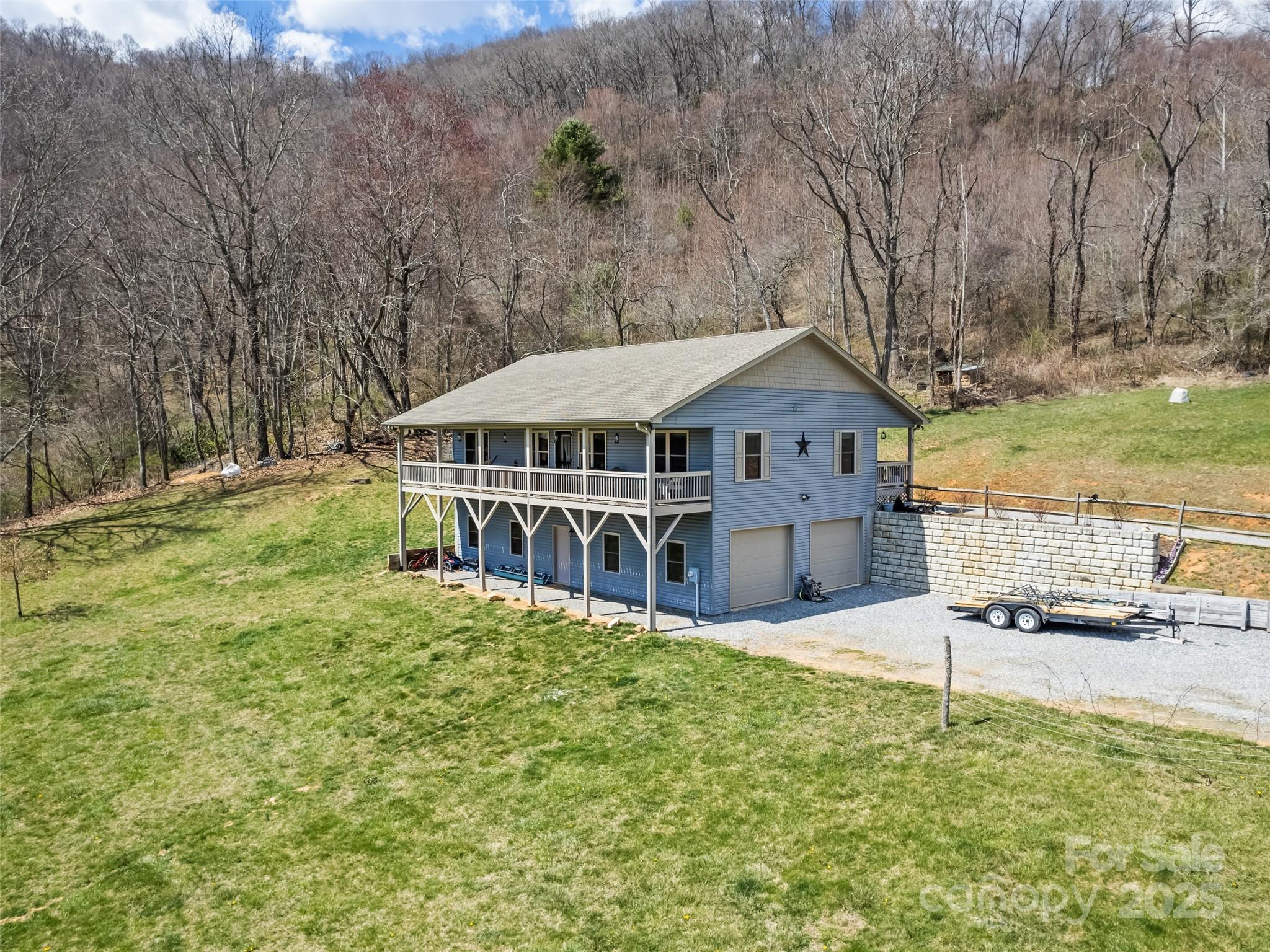 153 Trinity Drive Clyde, NC 28721 - Photo 4 of 38 a house with swimming pool in front of it
