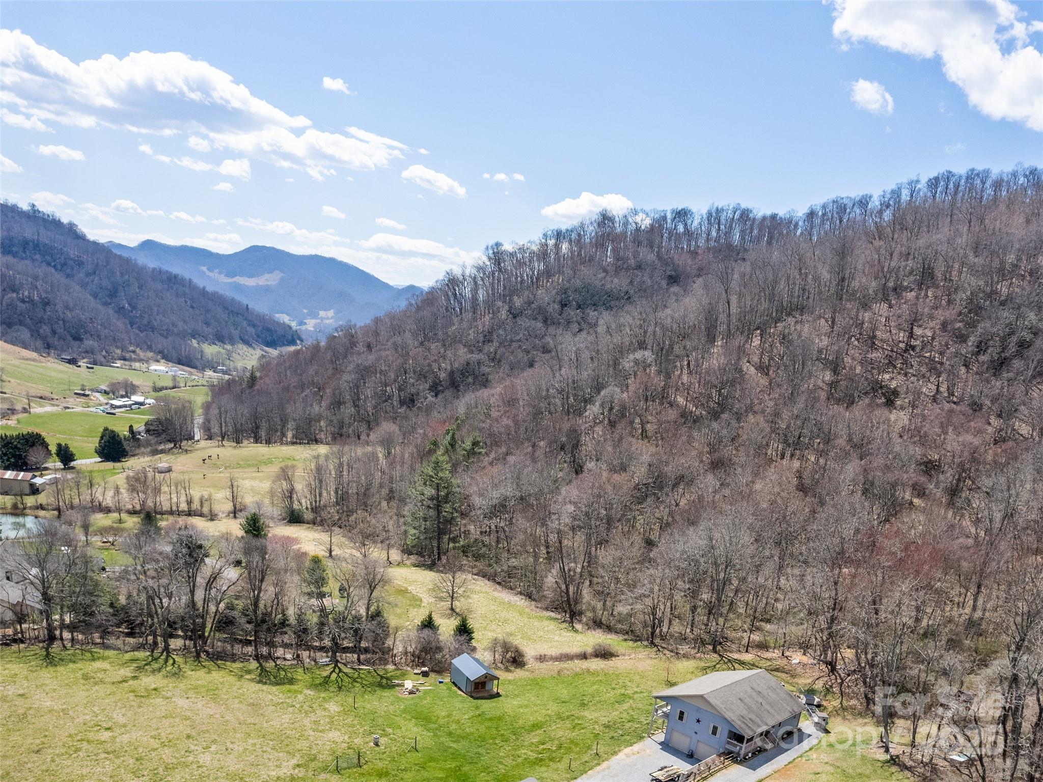 153 Trinity Drive Clyde, NC 28721 - Photo 9 of 38 a view of a town with mountains in the background