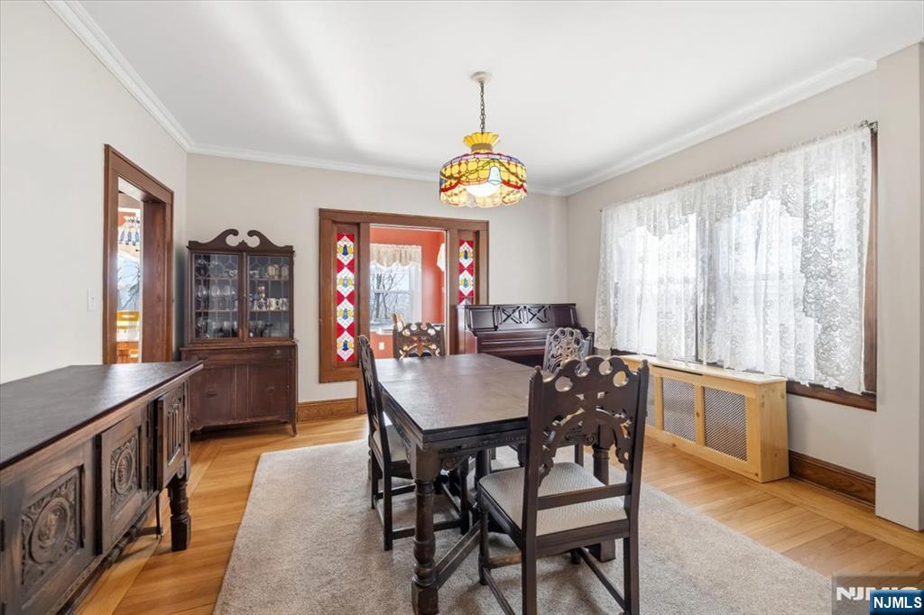 119 Overpeck Avenue Ridgefield Park, NJ 07660 - Photo 8 of 44 a view of a dining room with furniture window and wooden floor