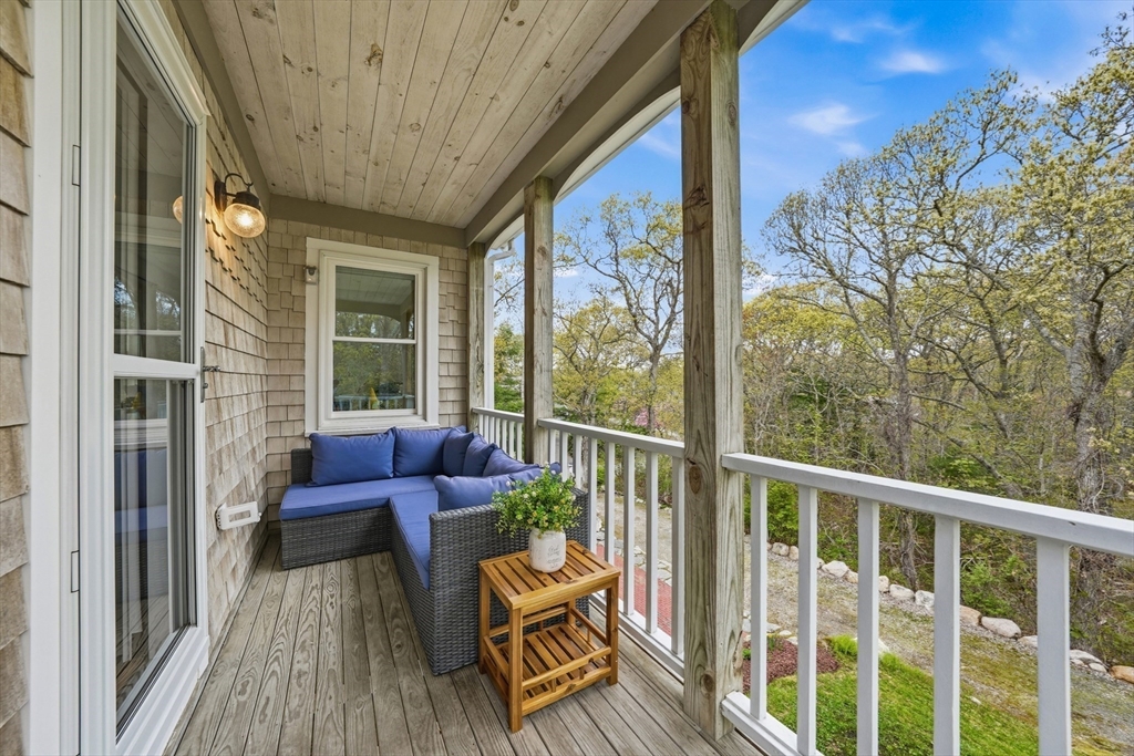 55 Ridgeview Drive Falmouth, MA 02540 - Photo 29 of 32 a balcony with furniture and wooden floor