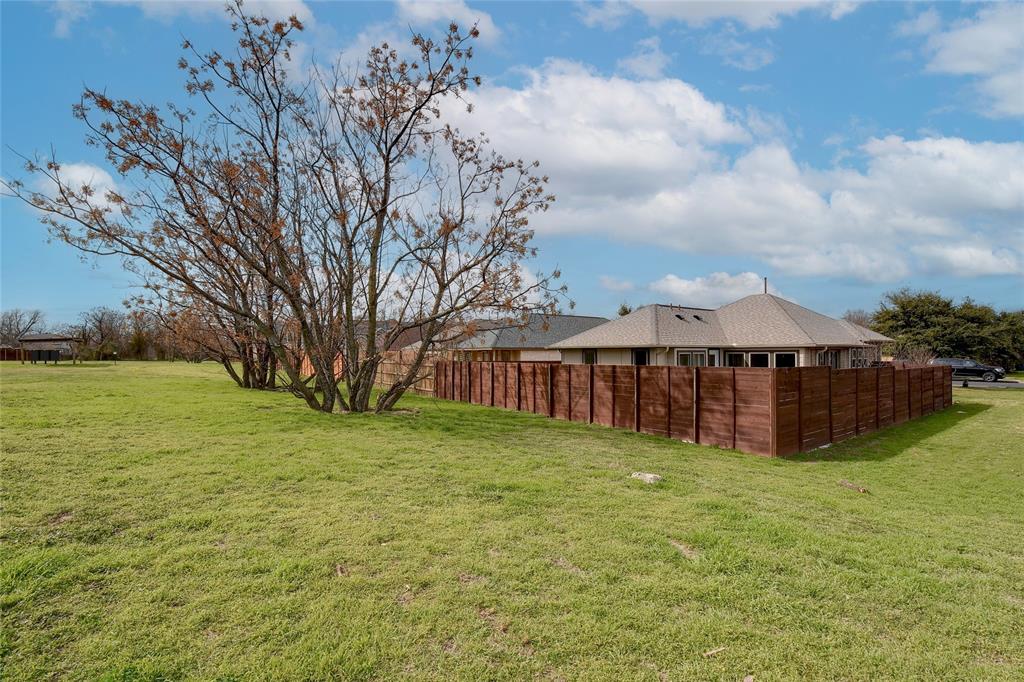2513 Winchell Lane Austin, TX 78725 - Photo 16 of 23 a view of a yard with wooden fence