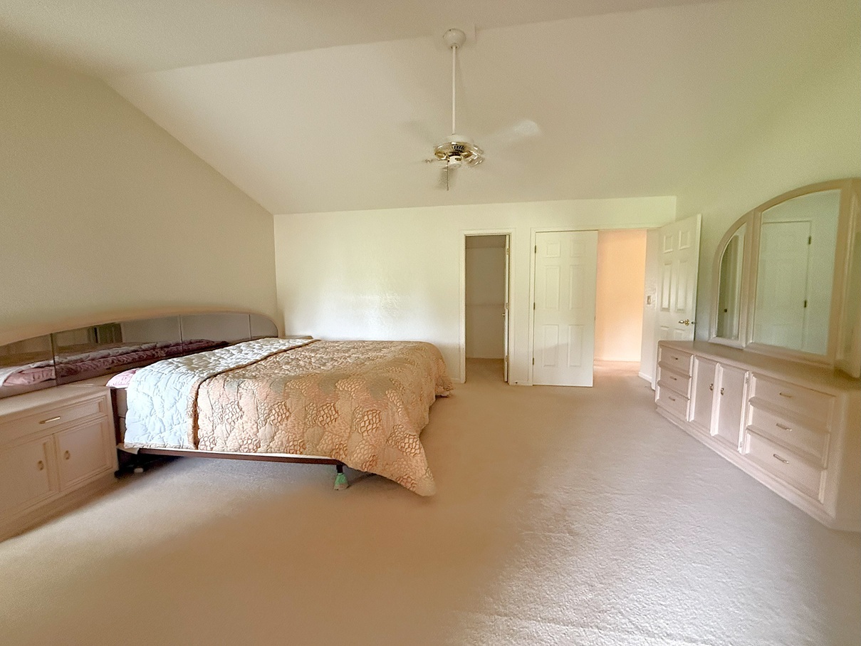 132 Fox Trot Dixon, IL 61021 - Photo 18 of 42 a spacious bedroom with a bed and a cabinets