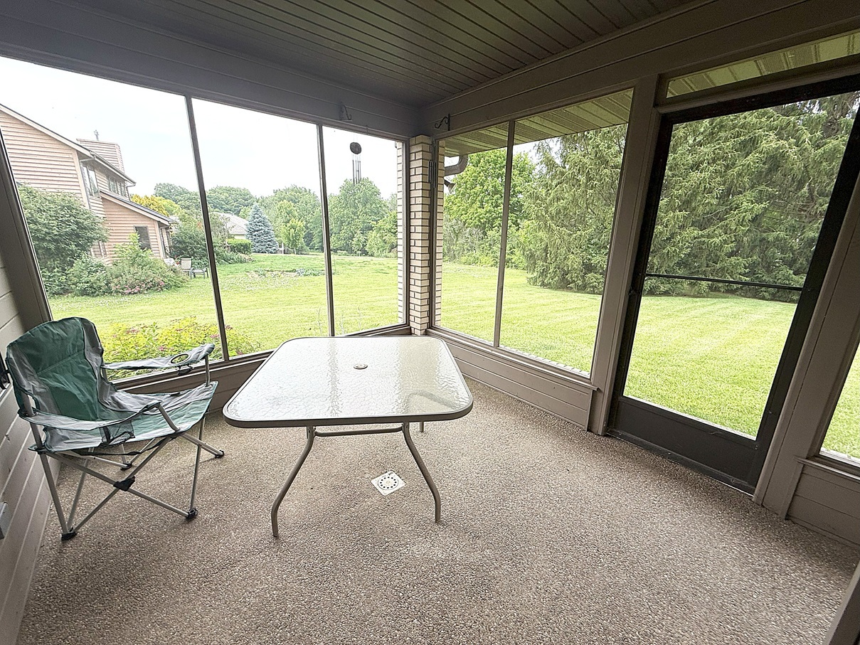 132 Fox Trot Dixon, IL 61021 - Photo 31 of 42 a living room with a floor to ceiling window and a table