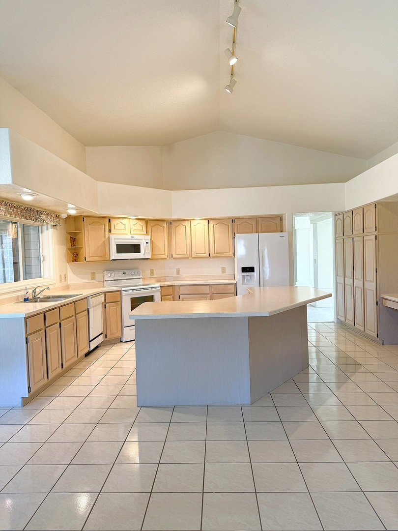 132 Fox Trot Dixon, IL 61021 - Photo 8 of 42 a large white kitchen with cabinets and a window