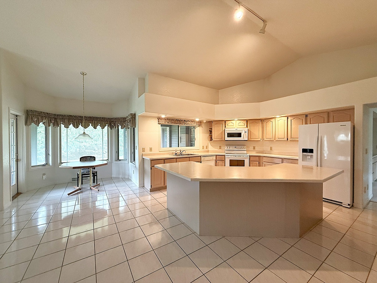 132 Fox Trot Dixon, IL 61021 - Photo 9 of 42 a large kitchen with kitchen island a sink and a large window