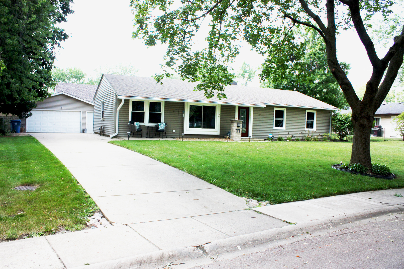 77 Eastfield Road Montgomery, IL 60538 - Photo 1 of 1 a front view of a house with a garden