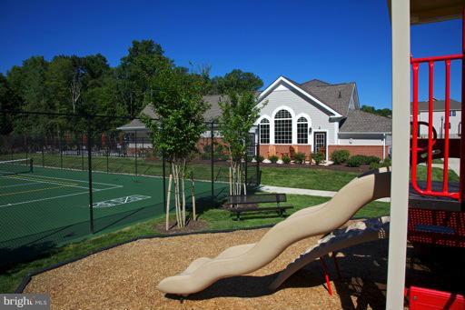 7650 Elmcrest Road Hanover, MD 21076 - Photo 6 of 12 a view of a house with a yard and a garden