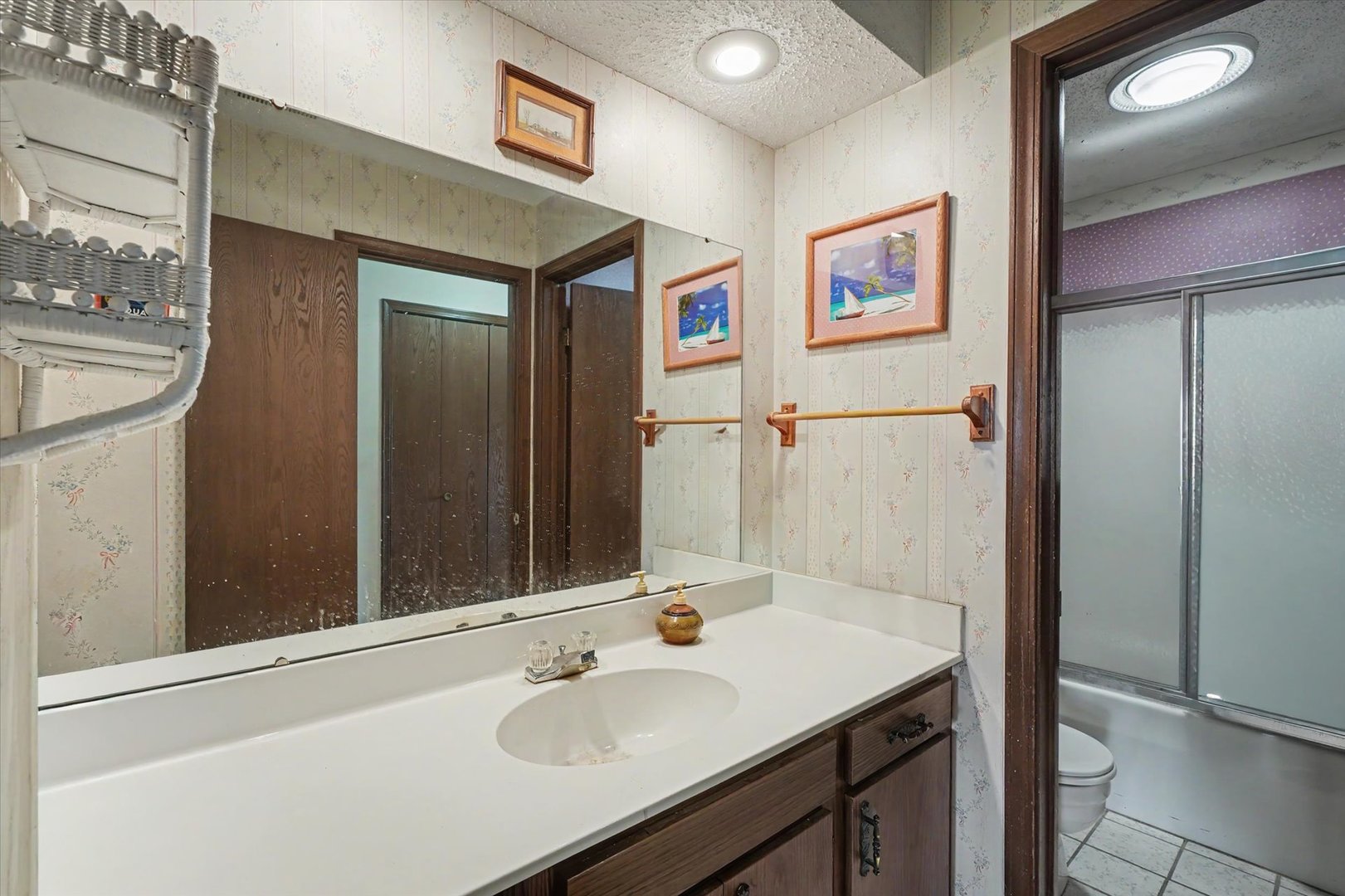 711 Higgins Road Champaign, IL 61822 - Photo 19 of 23 a bathroom with a sink and a mirror