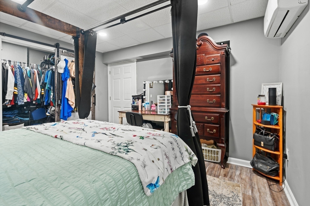 46-48 Walnut Street Peabody, MA 01960 - Photo 17 of 25 a bed room with a bed and a closet