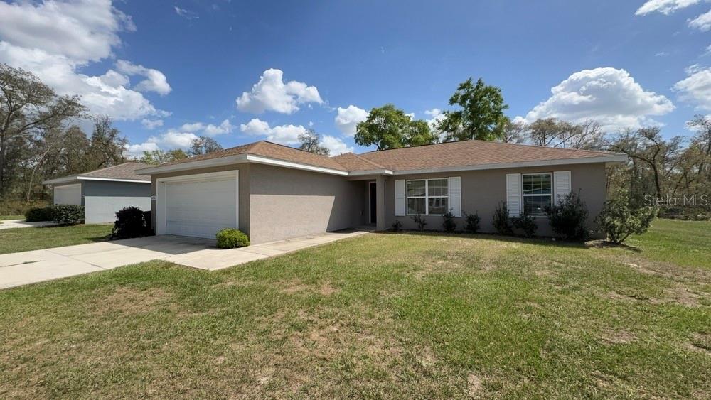 4110 Southwest 132nd Lane Ocala, FL 34473 - Photo 1 of 30 a view of a house with a yard and potted plants