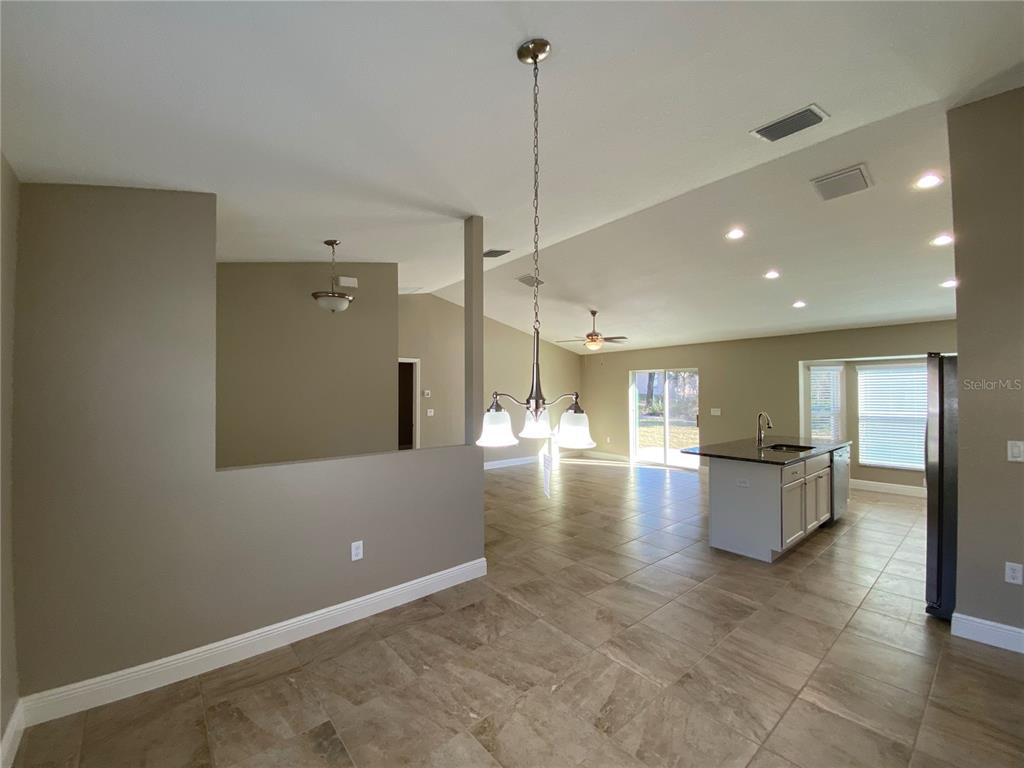 4110 Southwest 132nd Lane Ocala, FL 34473 - Photo 11 of 30 a view of a living room kitchen and a window
