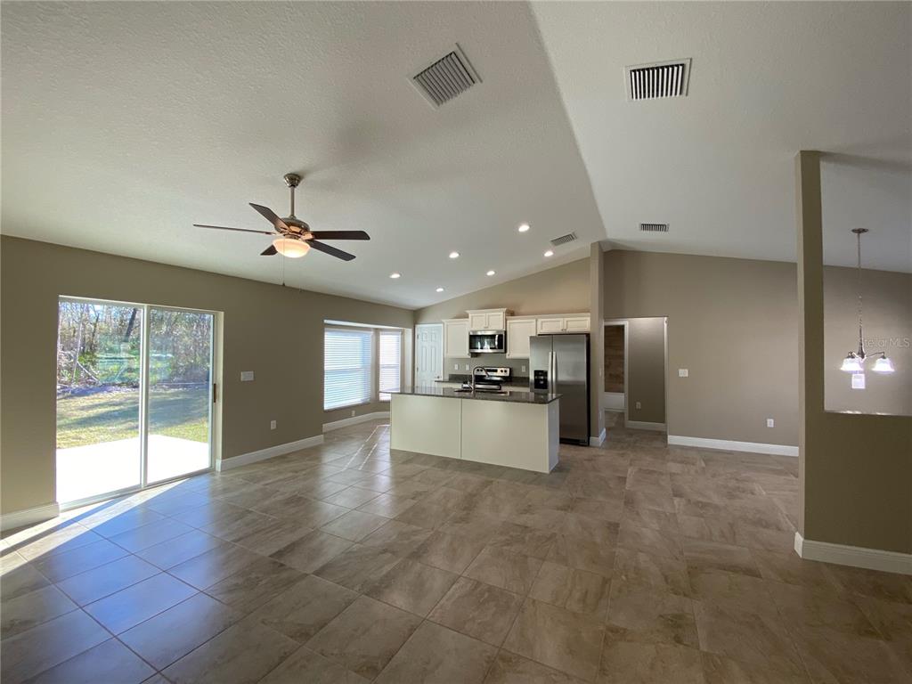 4110 Southwest 132nd Lane Ocala, FL 34473 - Photo 14 of 30 a living room with stainless steel appliances furniture and a kitchen view