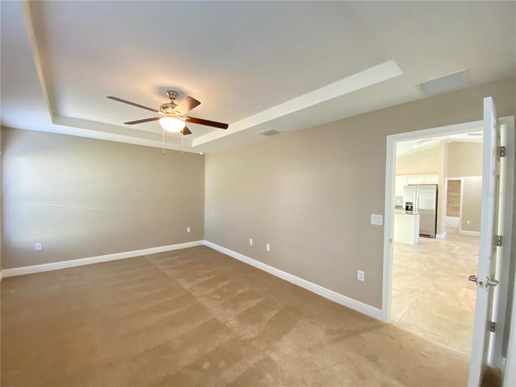 4110 Southwest 132nd Lane Ocala, FL 34473 - Photo 18 of 30 en empty room with a ceiling fan and a window