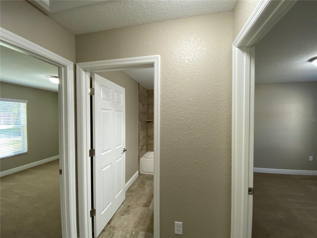 4110 Southwest 132nd Lane Ocala, FL 34473 - Photo 22 of 30 a view of a bathroom from a hallway