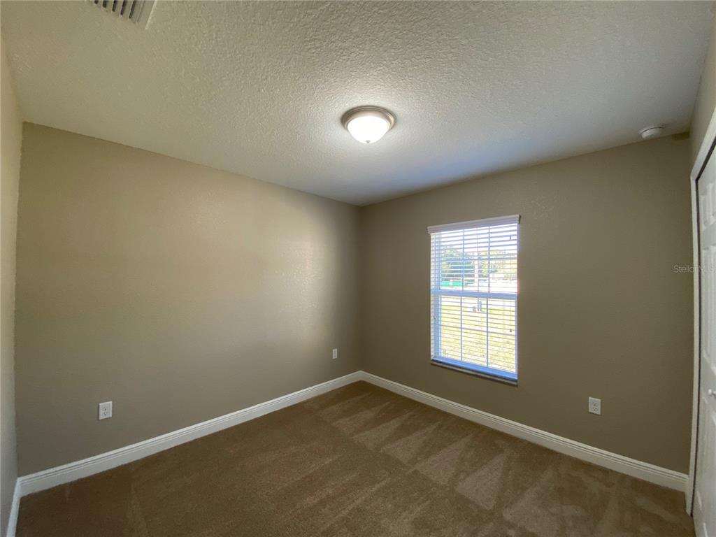 4110 Southwest 132nd Lane Ocala, FL 34473 - Photo 23 of 30 an empty room with a window