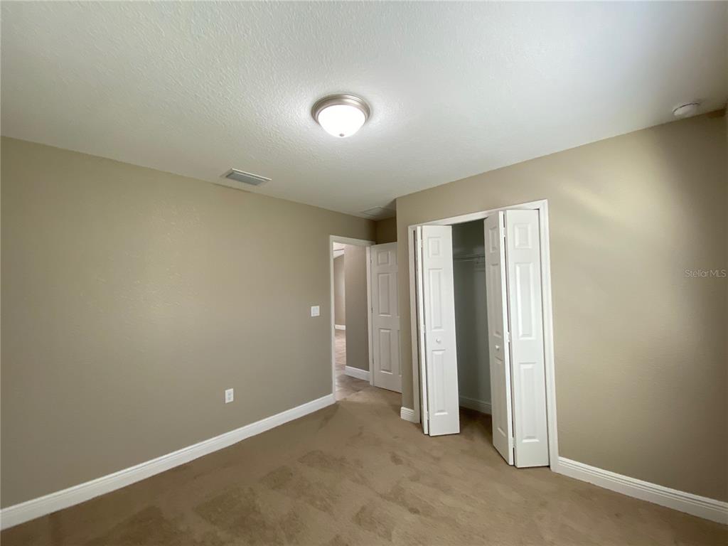 4110 Southwest 132nd Lane Ocala, FL 34473 - Photo 24 of 30 an empty room with closet area