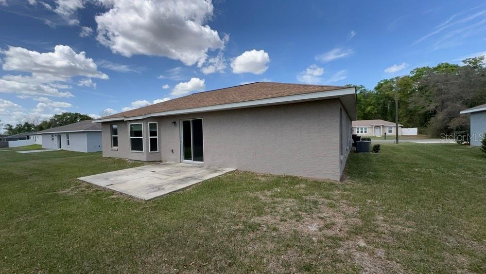 4110 Southwest 132nd Lane Ocala, FL 34473 - Photo 30 of 30 a backyard of a house with table and chairs