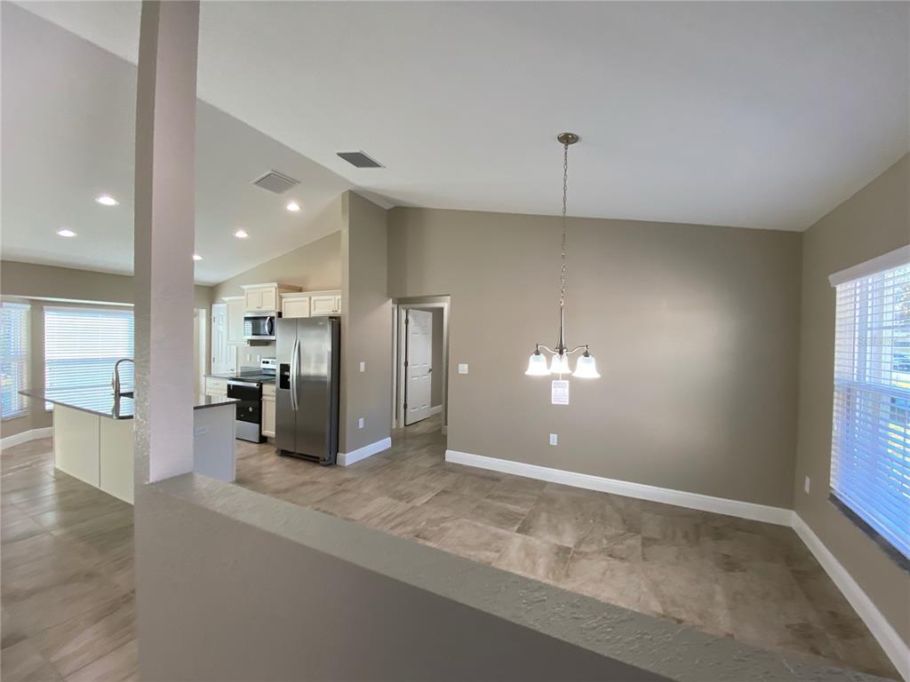 4110 Southwest 132nd Lane Ocala, FL 34473 - Photo 4 of 30 a view of a living room a ceiling fan and window in a room