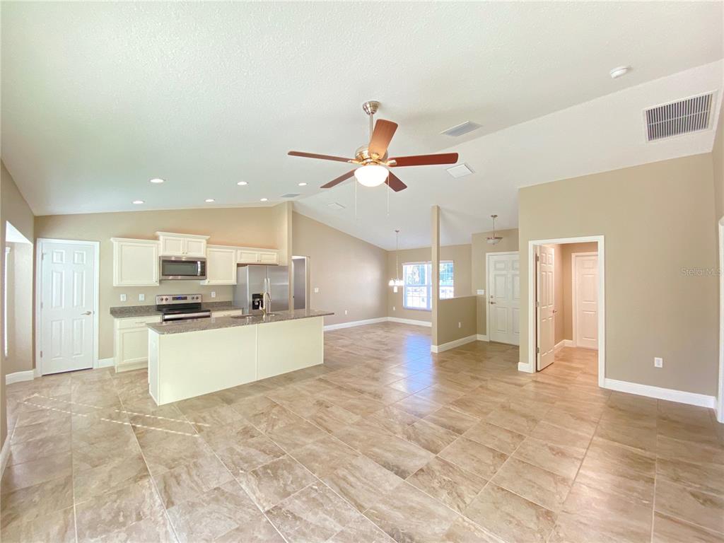 4110 Southwest 132nd Lane Ocala, FL 34473 - Photo 7 of 30 a view of a kitchen with a sink and microwave