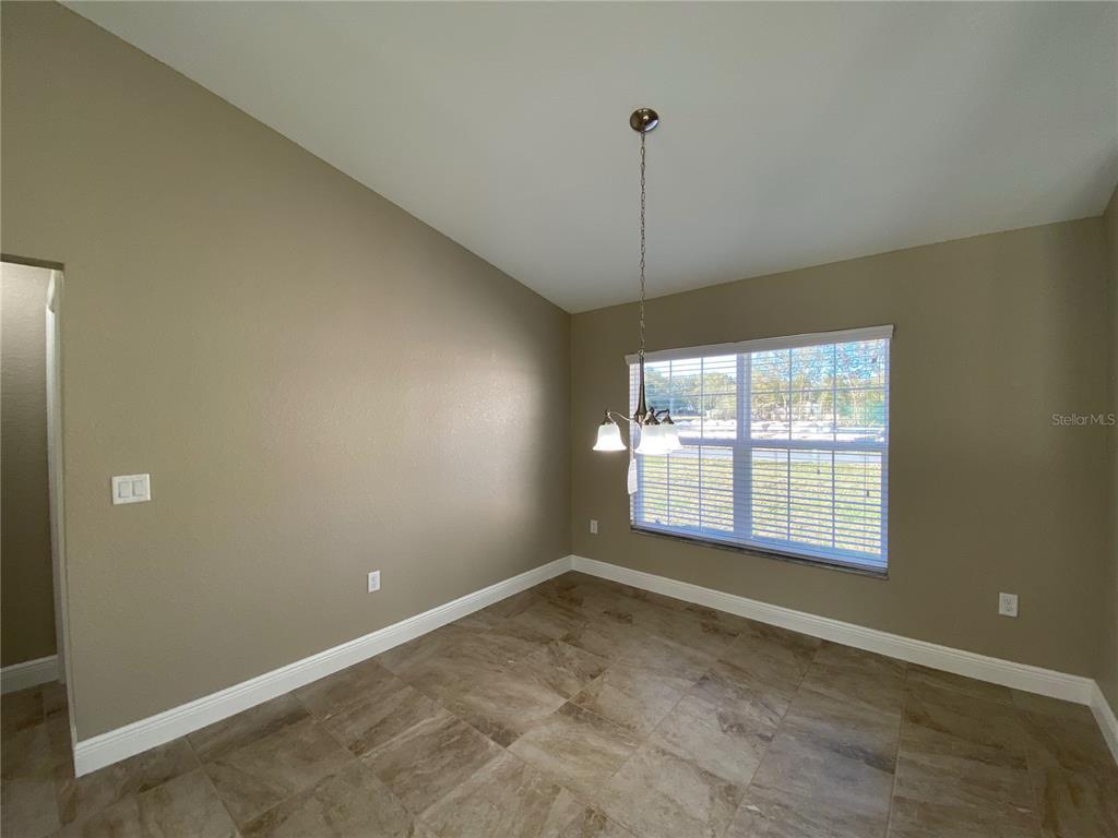 4110 Southwest 132nd Lane Ocala, FL 34473 - Photo 10 of 30 a view of an empty room with a window