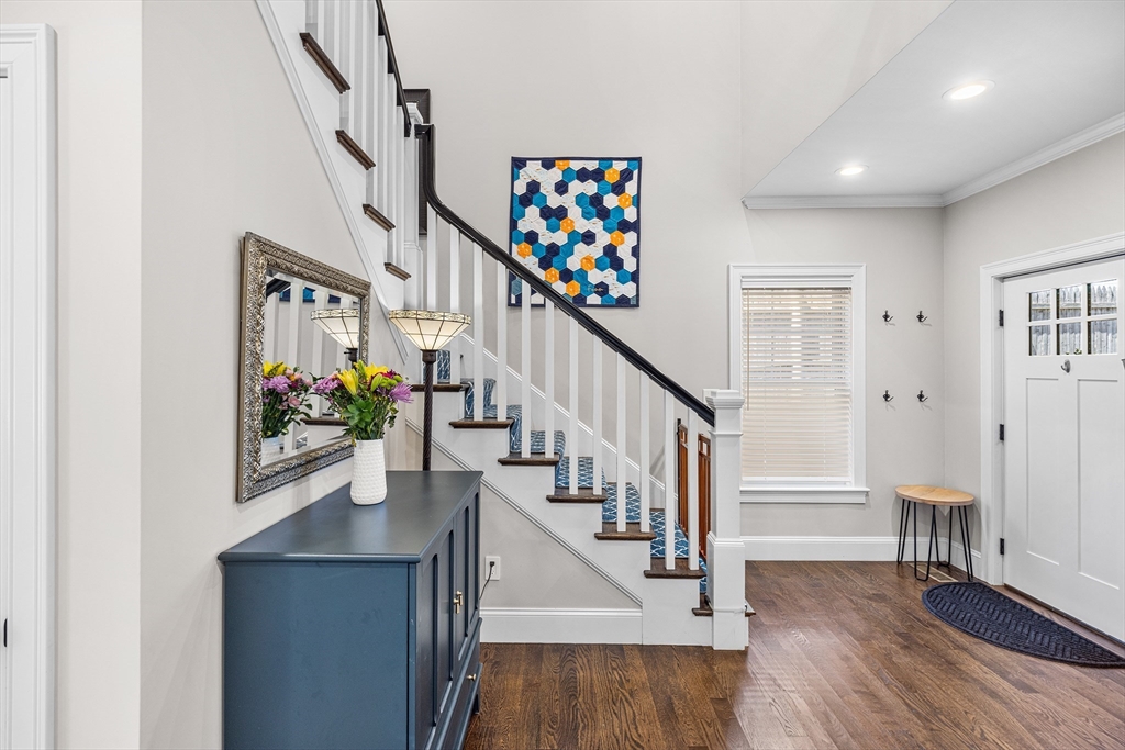 48 Hillcrest Road Waltham, MA 02451 - Photo 17 of 42 a view of entryway with stairs and wooden floor