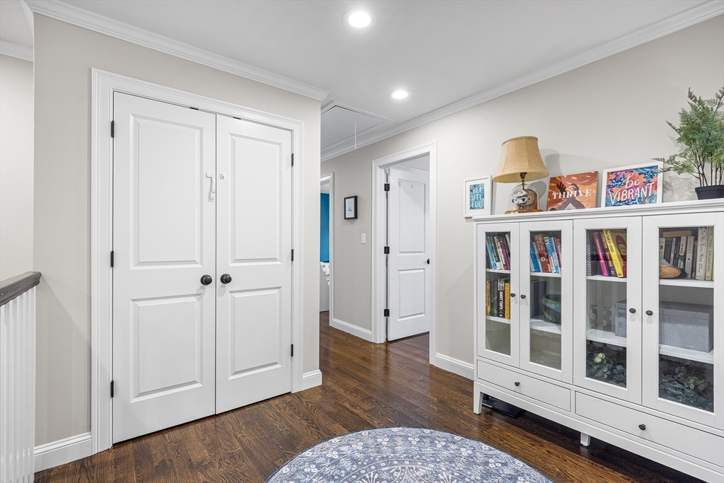 48 Hillcrest Road Waltham, MA 02451 - Photo 19 of 42 a living room with furniture wooden floor and baby crib