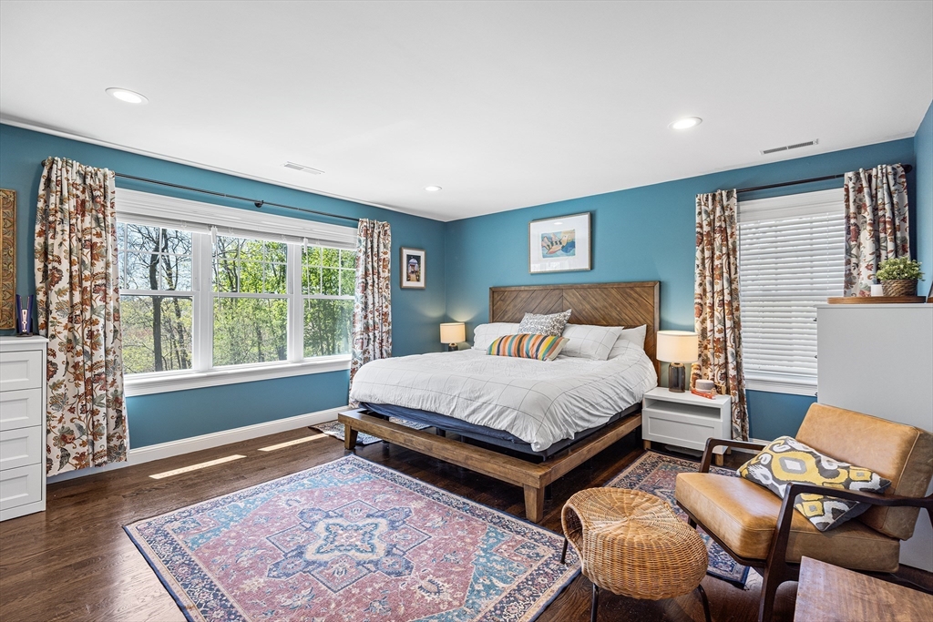 48 Hillcrest Road Waltham, MA 02451 - Photo 20 of 42 a bedroom with a bed and wooden floor
