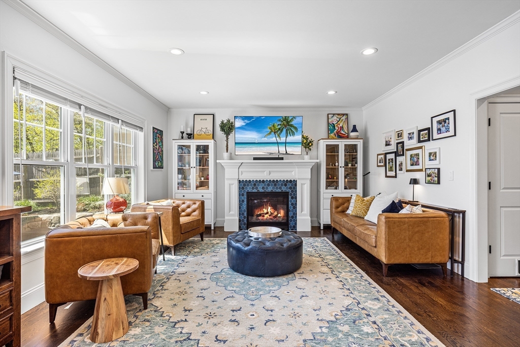 48 Hillcrest Road Waltham, MA 02451 - Photo 2 of 42 a living room with furniture and a fireplace