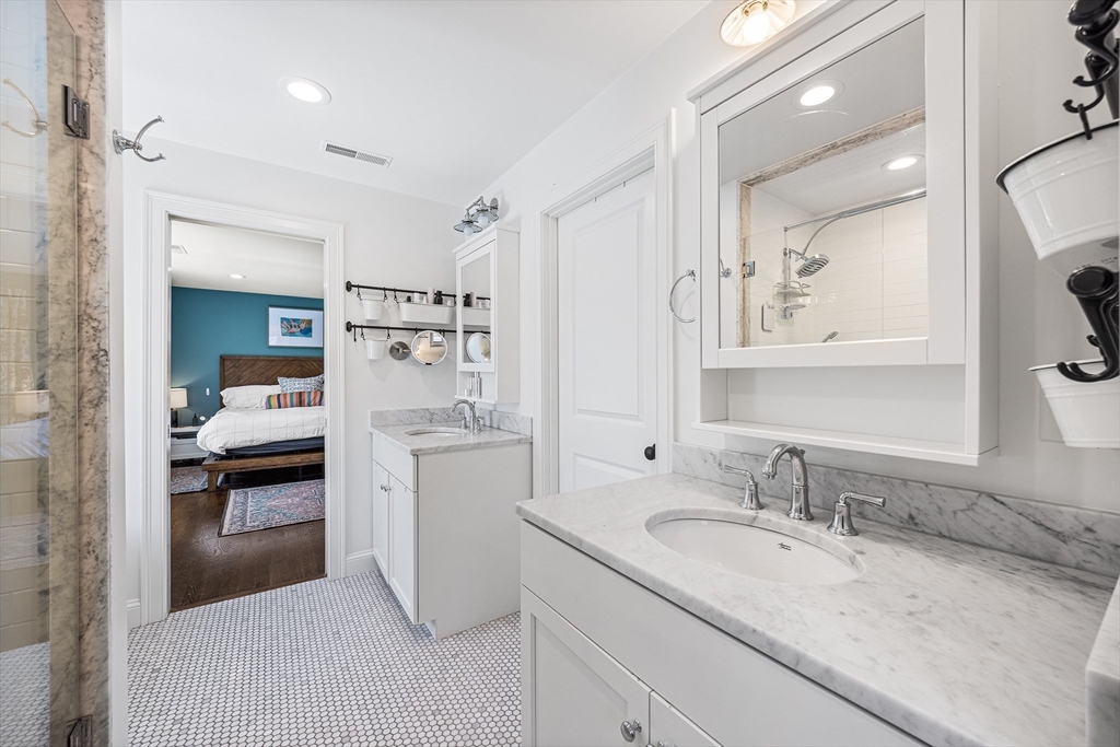 48 Hillcrest Road Waltham, MA 02451 - Photo 22 of 42 a en suite bathroom with a sink and a mirror