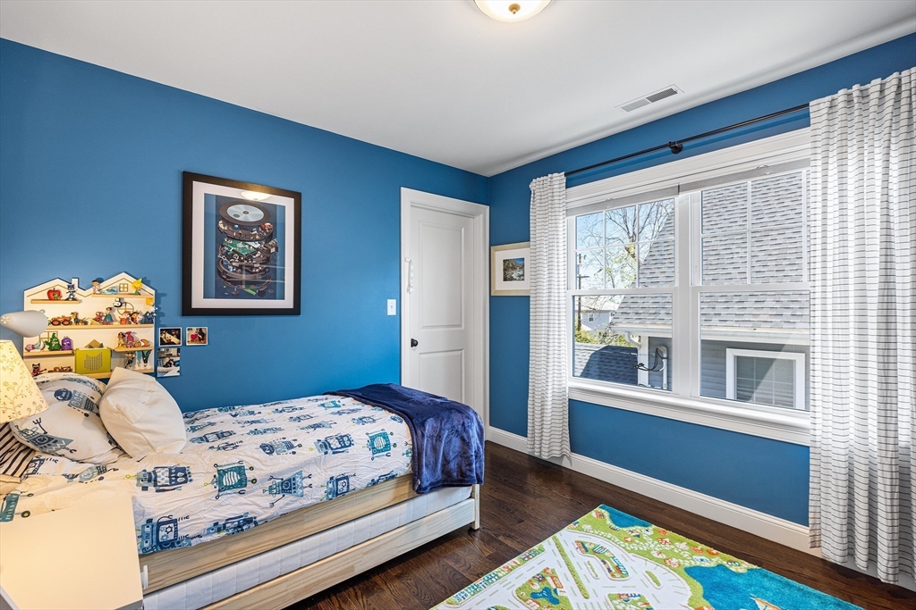 48 Hillcrest Road Waltham, MA 02451 - Photo 27 of 42 a bedroom with a bed and a window