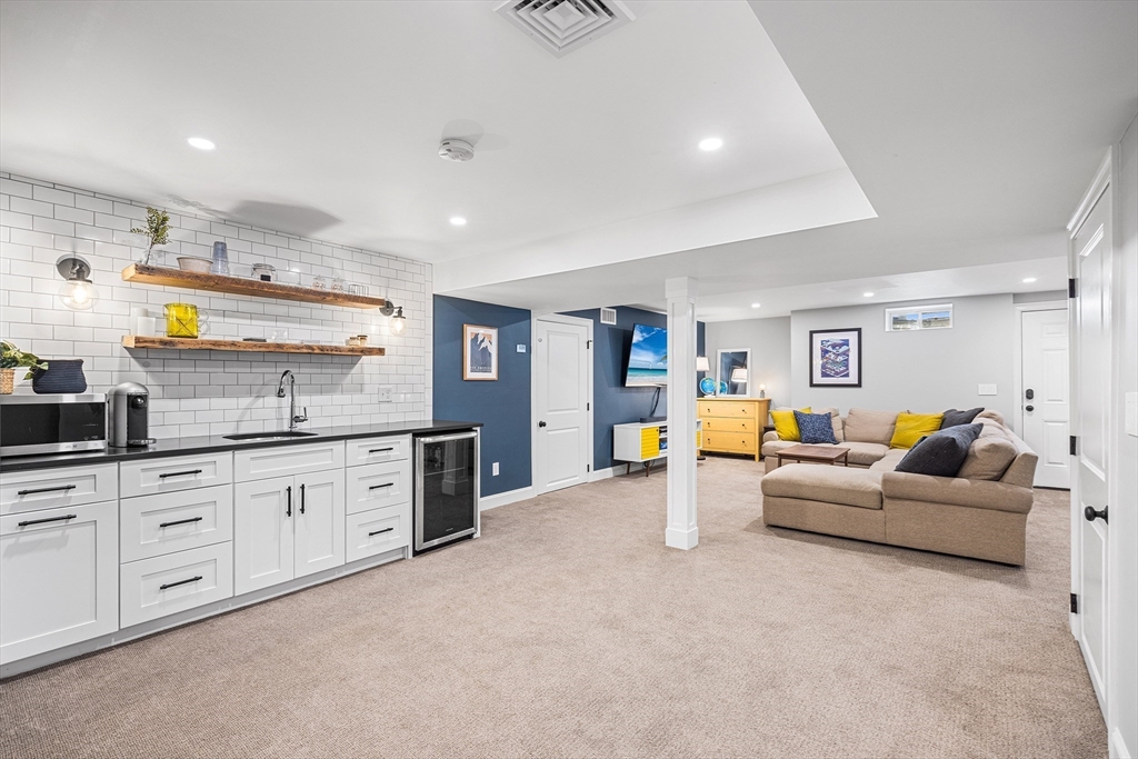 48 Hillcrest Road Waltham, MA 02451 - Photo 30 of 42 a living room with furniture and flat screen tv