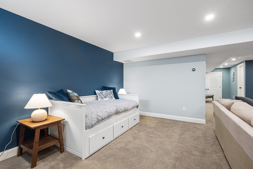 48 Hillcrest Road Waltham, MA 02451 - Photo 34 of 42 a bed room with a bed and a chair