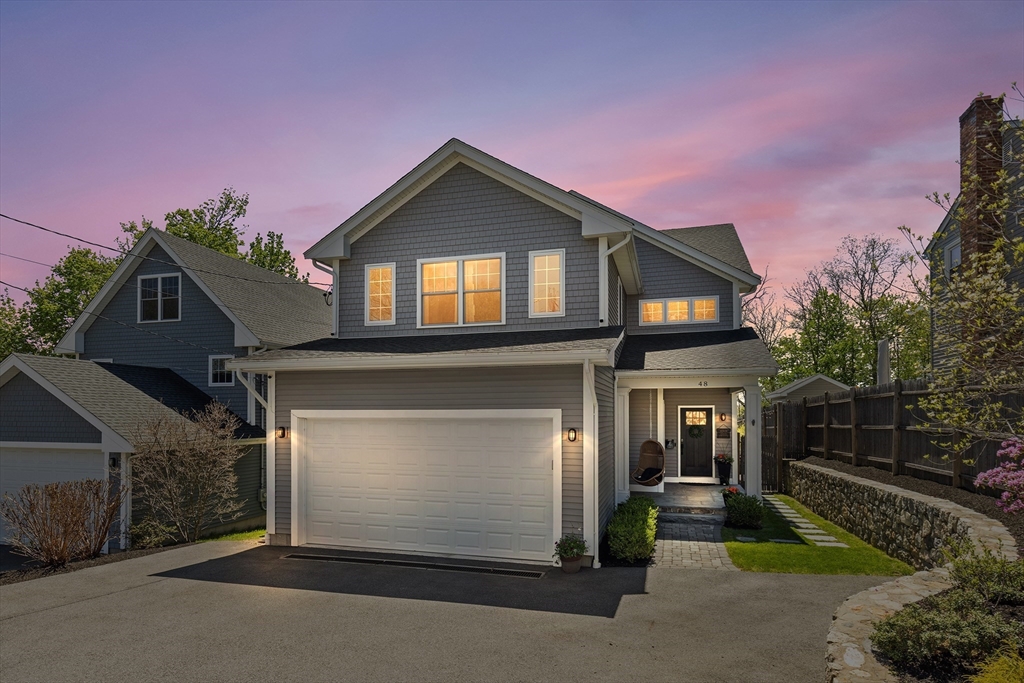 48 Hillcrest Road Waltham, MA 02451 - Photo 41 of 42 a front view of a house with a yard and garage