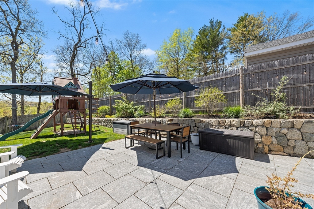 48 Hillcrest Road Waltham, MA 02451 - Photo 8 of 42 a view of outdoor dining space with a patio and plants